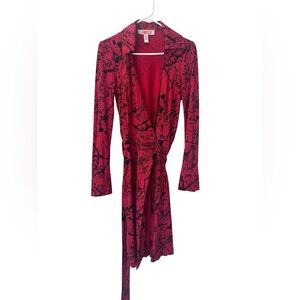 Diane von Furstenberg silk vintage red wrap dress with black splatter print.